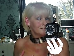 Mature Amber shows off her big tits for the camera