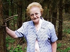 Granny flashing in the wood hoping to find some unknown cock